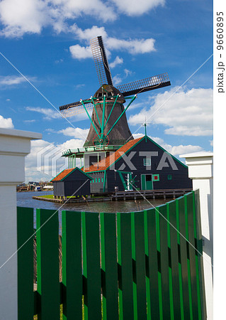 Traditional Dutch windmills with canal in Zaanse Schans near the Amsterdam, Holland 9660895