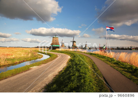Traditional Dutch windmills with canal in Zaanse Schans near the Amsterdam, Holland 9660896