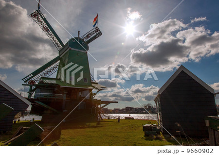 Traditional Dutch windmills with canal in Zaanse Schans near the Amsterdam, Holland 9660902