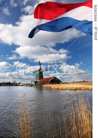 Traditional Dutch windmills with canal in Zaanse Schans near the Amsterdam, Holland 9660906