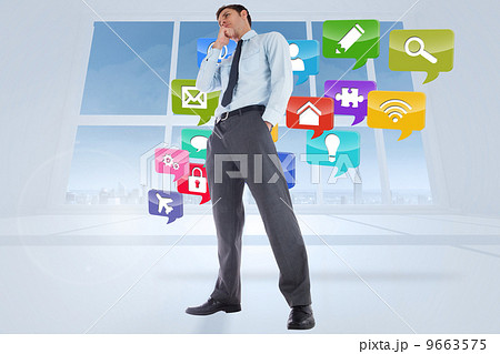 Composite image of thoughtful businessman with hand on chin 9663575