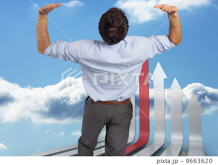 Composite image of businessman standing with hands up Composite image of businessman standing with hands up 9663620