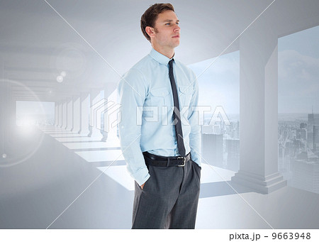 Composite image of serious businessman standing with hands in po Composite image of serious businessman standing with hands in po 9663948