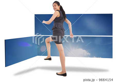 Composite image of businesswoman stepping up Composite image of businesswoman stepping up 9664154