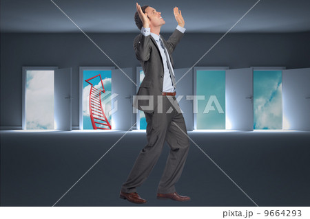 Composite image of businessman posing with arms raised 9664293