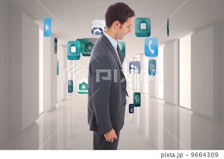 Composite image of cheerful handsome businessman standing 9664309