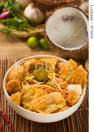 singapore laksa curry noodles with plenty of raw ingredients as singapore laksa curry noodles with plenty of raw ingredients as 9668071
