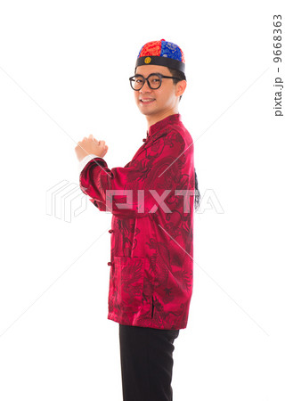 Asian man with Chinese traditional dress cheongsam and gong xi f Asian man with Chinese traditional dress cheongsam and gong xi f 9668363