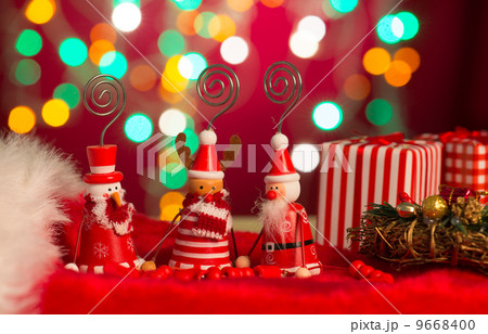 christmas elves, santa and snowman toy with lights background christmas elves, santa and snowman toy with lights background 9668400