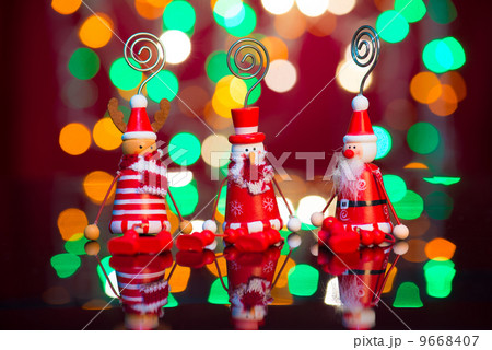 christmas elves, santa and snowman toy with lights background 9668407
