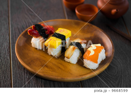 Sushi Assortment On wooden Dish, close up 9668599