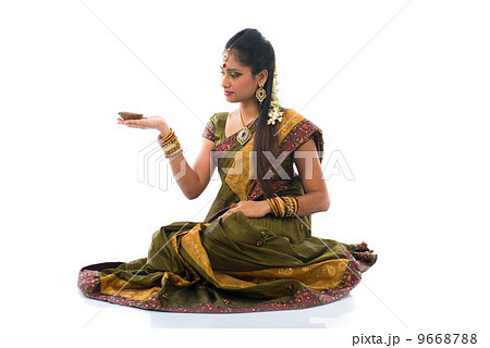 traditional indian woman with oil lamp during the celebration of 9668788