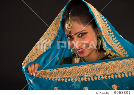 young south Indian woman in traditional sari dress young south Indian woman in traditional sari dress 9668801