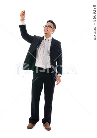 male writing something on glass board with marker male writing something on glass board with marker 9669239