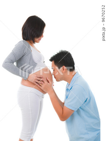chinese Man Listening To Pregnant Woman's Stomach chinese Man Listening To Pregnant Woman's Stomach 9670252