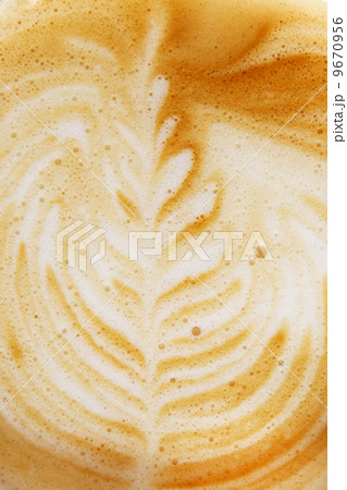 Coffee cup with artistic cream decoration 9670956