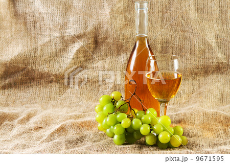 Wine and grapes on vintage background 9671595
