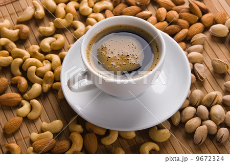 Coffee with nuts on background Coffee with nuts on background 9672324