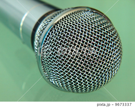 Silver metallic microphone taken closeup. Silver metallic microphone taken closeup. 9673337