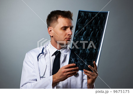 Medical doctor with MRI spinal scan 9675175
