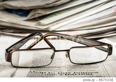 Glasses on newspaper Glasses on newspaper 9675338