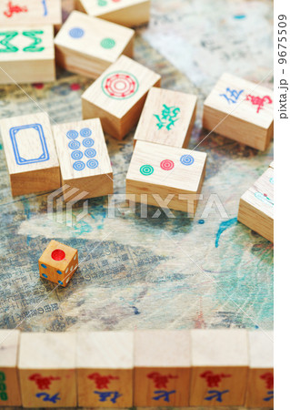 playing in mahjong game by wooden tiles 9675509