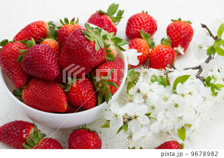 Pile of strawberries  with spring twigs 9678982