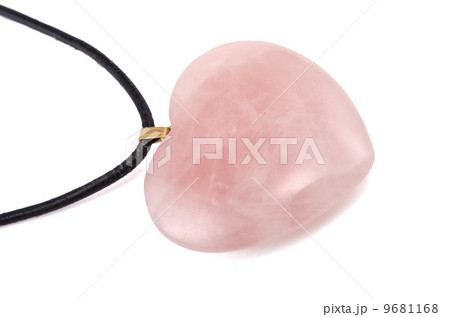 Rose quartz heart with leather string on white Rose quartz heart with leather string on white 9681168