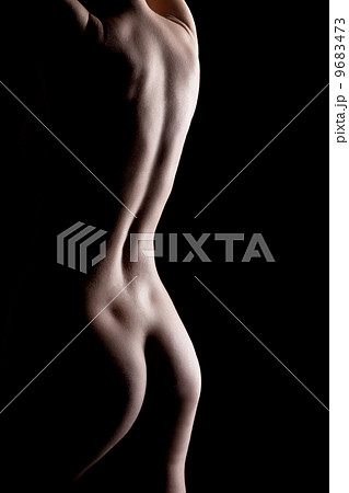 nude female torso on black background 9683473