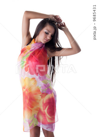 Dreamy long-haired model posing in colorful pareos Dreamy long-haired model posing in colorful pareos 9685431