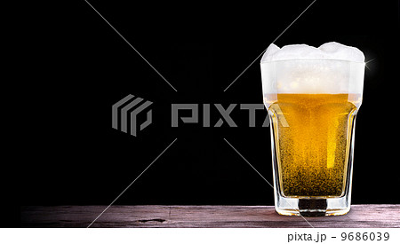 Frosty glass of light beer  9686039
