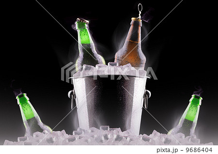 Beer bottles in ice bucket Beer bottles in ice bucket 9686404