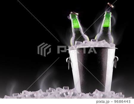 Beer bottles in ice bucket Beer bottles in ice bucket 9686443