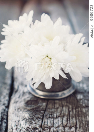 White Flowers on the Wooden Background White Flowers on the Wooden Background 9686722