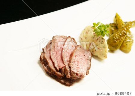 Slices of meat with marinated cucumbers Slices of meat with marinated cucumbers 9689407