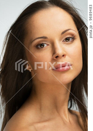 Beautiful young brunette woman with brown eyes and long hair Beautiful young brunette woman with brown eyes and long hair 9689483