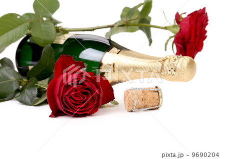 Red rose and a bottle of champagne. Red rose and a bottle of champagne. 9690204