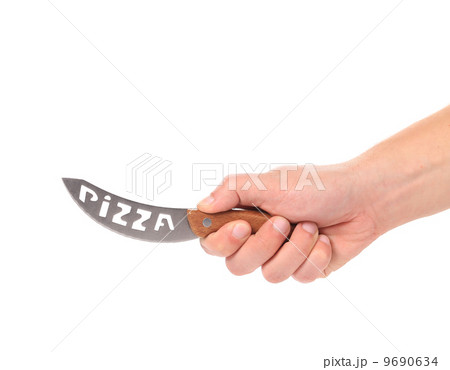 Hand holds pizza's knife. 9690634