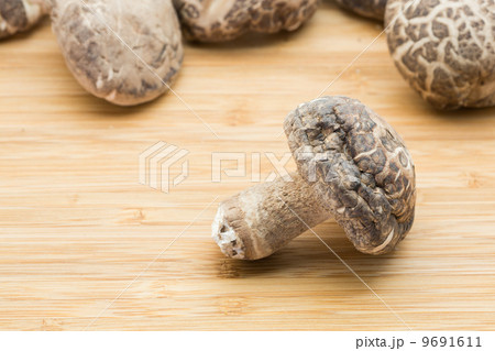 Dried mushrooms on the wooden background Dried mushrooms on the wooden background 9691611