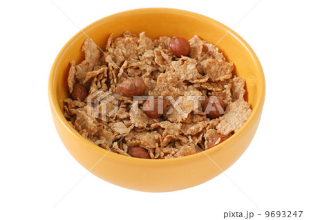 cereals with nuts in yellow bowl cereals with nuts in yellow bowl 9693247