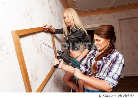 Attractive women with puncher and frame Attractive women with puncher and frame 9696447