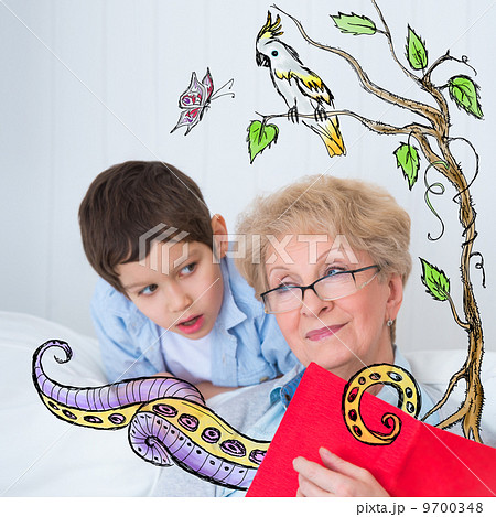 Grandmother and little boy reading book happy together at home. 9700348