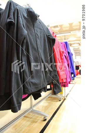 collection of women's clothes hanging on a rack collection of women's clothes hanging on a rack 9701986