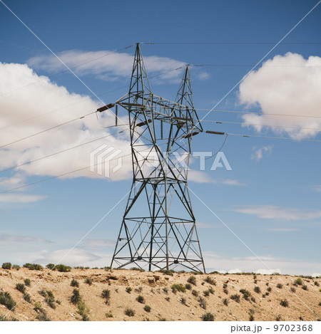A tall pylon carrying power lines, in the desert near Tucson. A tall pylon carrying power lines, in the desert near Tucson. 9702368