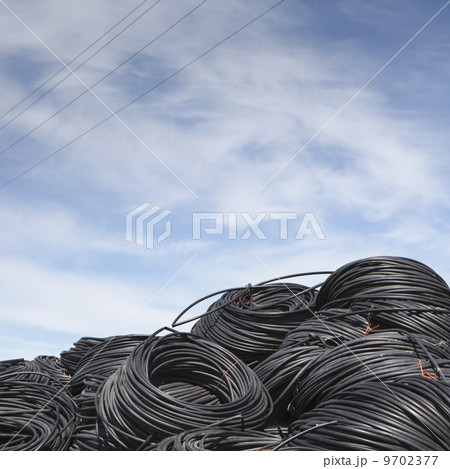 Heap of coiled plastic irrigation tubing. Heap of coiled plastic irrigation tubing. 9702377