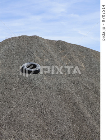 Gravel piles are used for road maintenance and construction purposes. Gravel piles are used for road maintenance and construction purposes. 9702514