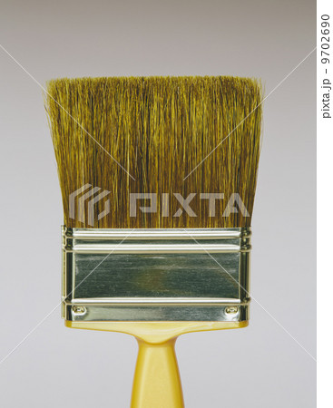A bristle paintbrush with a yellow handle. A bristle paintbrush with a yellow handle. 9702690