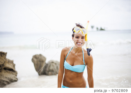 A young woman wearing snorkeling gear on the Samana Peninsula in the Dominican Republic. A young woman wearing snorkeling gear on the Samana Peninsula in the Dominican Republic. 9702809