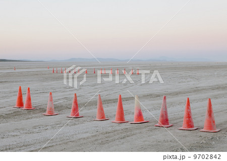 Row of traffic cones on the flat desert surface of Black Rock, Nevada. 9702842