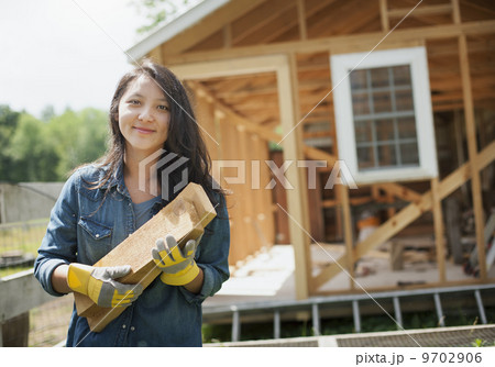 A young woman on a traditional farm in the countryside of New York State, USA A young woman on a traditional farm in the countryside of New York State, USA 9702906